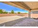 Spacious backyard with gravel, brick wall, and paver patio, ideal for outdoor living at 6280 Lamont Hills Ave, Las Vegas, NV 89139