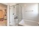 This bathroom features a bathtub and shower, complete with clear doors at 6280 Lamont Hills Ave, Las Vegas, NV 89139
