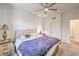 Comfortable bedroom with carpet, ceiling fan, tufted headboard, and side tables at 6280 Lamont Hills Ave, Las Vegas, NV 89139