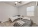 Neutral bedroom with two twin beds, a ceiling fan, and a window at 6280 Lamont Hills Ave, Las Vegas, NV 89139