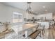 Dining area featuring a modern table set and view into the adjacent modern kitchen at 6280 Lamont Hills Ave, Las Vegas, NV 89139