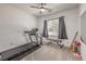 Light and airy gym with equipment and a large window at 6280 Lamont Hills Ave, Las Vegas, NV 89139