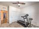 Carpeted gym with a treadmill and closet doors at 6280 Lamont Hills Ave, Las Vegas, NV 89139