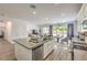 Kitchen island with double sink and view into the dining area and adjacent Gathering room at 6280 Lamont Hills Ave, Las Vegas, NV 89139