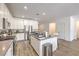 Spacious kitchen features an island with stainless steel appliances and granite countertops at 6280 Lamont Hills Ave, Las Vegas, NV 89139