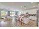 Open concept kitchen with island, stainless steel appliances and view to the breakfast nook at 6280 Lamont Hills Ave, Las Vegas, NV 89139