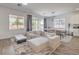 Stylish living area featuring contemporary furnishings, sleek floors, and lots of natural light at 6280 Lamont Hills Ave, Las Vegas, NV 89139