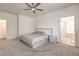 Spacious main bedroom featuring a ceiling fan and ensuite bathroom at 6280 Lamont Hills Ave, Las Vegas, NV 89139