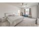Modern main bedroom features a ceiling fan and window with curtains at 6280 Lamont Hills Ave, Las Vegas, NV 89139