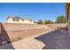 Spacious backyard with a stamped concrete patio and low-maintenance landscaping, perfect for outdoor living at 6417 Giant Oak St, North Las Vegas, NV 89084