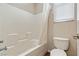 Standard bath with tiled walls and shower curtain at 6417 Giant Oak St, North Las Vegas, NV 89084