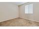 Carpeted bedroom with ample natural light from a large window at 6417 Giant Oak St, North Las Vegas, NV 89084