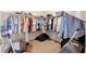 Walk-in closet provides ample storage space with clothes racks and room for organization at 6417 Giant Oak St, North Las Vegas, NV 89084