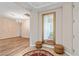 Bright entryway featuring a large mirror, hardwood floors, a chandelier, and neutral wall colors at 6417 Giant Oak St, North Las Vegas, NV 89084
