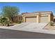 Charming home with a three-car garage, desert landscaping, and a well-maintained exterior at 6417 Giant Oak St, North Las Vegas, NV 89084