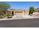 Charming single-story home showcasing a well-maintained yard, and a spacious three car garage at 6417 Giant Oak St, North Las Vegas, NV 89084