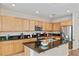 Beautiful kitchen with stainless steel appliances, granite countertops, and ample storage space at 6417 Giant Oak St, North Las Vegas, NV 89084