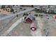 Aerial view of a secluded cabin with a garage, nestled in a serene landscape alongside a winding road at 660 E Aspen Meadow Dr, Mammoth Creek, UT 84735