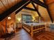 Comfortable bedroom with hardwood floors, wood-paneled walls, and a cozy double bed with mountain-themed bedding at 660 E Aspen Meadow Dr, Mammoth Creek, UT 84735