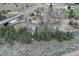 Scenic view of a flowing creek winding through a natural landscape with trees and vegetation at 660 E Aspen Meadow Dr, Mammoth Creek, UT 84735