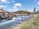 Scenic view of a rocky creek with clear water flowing through a natural landscape at 660 E Aspen Meadow Dr, Mammoth Creek, UT 84735