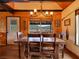 Dining room with wooden table, chairs, chandelier, and views at 660 E Aspen Meadow Dr, Mammoth Creek, UT 84735