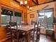 Dining room with wooden table, chairs, chandelier, and views at 660 E Aspen Meadow Dr, Mammoth Creek, UT 84735