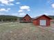 Inviting cabin with a detached garage and ample yard space, offering a blend of comfort and convenience at 660 E Aspen Meadow Dr, Mammoth Creek, UT 84735