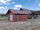 Charming log cabin-style home with an attached garage, showcasing rustic appeal and functional design at 660 E Aspen Meadow Dr, Mammoth Creek, UT 84735