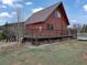 Rustic cabin featuring a spacious deck, ideal for relaxing and enjoying the peaceful outdoors at 660 E Aspen Meadow Dr, Mammoth Creek, UT 84735