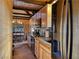 Updated kitchen features wooden cabinets, granite counters, and stainless-steel appliances at 660 E Aspen Meadow Dr, Mammoth Creek, UT 84735