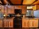 Updated kitchen features wooden cabinets, granite counters, and stainless-steel appliances at 660 E Aspen Meadow Dr, Mammoth Creek, UT 84735