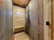 Walk-in shower with bench and rustic finishes at 660 E Aspen Meadow Dr, Mammoth Creek, UT 84735