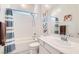 Bathroom with shower and bathtub, white cabinet and decorative towel rail at 759 Praire Plume St, Henderson, NV 89011