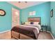 A serene bedroom featuring calm colors and a cozy bed for relaxation and restful sleep at 759 Praire Plume St, Henderson, NV 89011