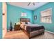 Comfortable bedroom with a queen-sized bed, nightstand, and neutral-toned décor at 759 Praire Plume St, Henderson, NV 89011