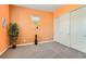 Bright bedroom features plush carpet, closet, and an orange accent wall at 759 Praire Plume St, Henderson, NV 89011