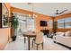 Bright dining area with a stylish chandelier and sliding glass doors to the backyard at 759 Praire Plume St, Henderson, NV 89011