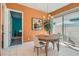 Cozy dining area with a round table and chairs, adjacent to sliding glass doors at 759 Praire Plume St, Henderson, NV 89011