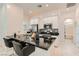 Contemporary kitchen with granite countertops, stainless steel appliances, and sleek breakfast bar seating at 759 Praire Plume St, Henderson, NV 89011