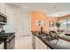Modern kitchen featuring a breakfast bar, granite counters, stainless steel appliances and gorgeous backsplash at 759 Praire Plume St, Henderson, NV 89011