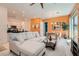 Spacious living room with contemporary furnishings, stylish decor, and seamless flow to the dining area and kitchen at 759 Praire Plume St, Henderson, NV 89011
