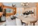 Inviting living room with open floorplan, modern furnishings, and stainless steel kitchen appliances at 759 Praire Plume St, Henderson, NV 89011