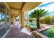 Enjoy the scenic view of a well manicured backyard with a fountain, palm trees, and a relaxing lounge chair at 7969 Bermuda Dunes Ave, Las Vegas, NV 89113