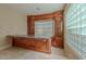 Living room bar boasts custom wood cabinetry, marble countertops, and abundant storage space at 7969 Bermuda Dunes Ave, Las Vegas, NV 89113