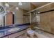Bathroom showcasing a walk-in shower with glass doors, granite counters, and modern finishes at 7969 Bermuda Dunes Ave, Las Vegas, NV 89113