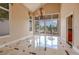 Elegant dining room featuring large windows and marble flooring at 7969 Bermuda Dunes Ave, Las Vegas, NV 89113