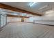 Large garage featuring tile floors, abundant lighting, and extensive cabinet storage at 7969 Bermuda Dunes Ave, Las Vegas, NV 89113