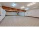 Spacious garage with tile flooring, ample lighting, and built-in storage cabinets at 7969 Bermuda Dunes Ave, Las Vegas, NV 89113