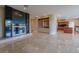 Open living space features a fireplace, marble floors, and built-in shelving at 7969 Bermuda Dunes Ave, Las Vegas, NV 89113